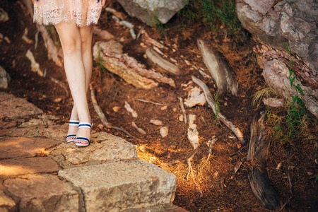 Female feet on a stone floor in Montenegro.の写真素材