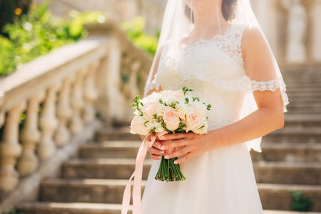 Wedding bouquet in hands of the bride. Wedding in Montenegroの写真素材