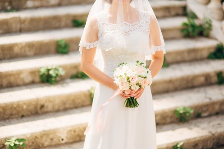 Wedding bouquet in hands of the bride. Wedding in Montenegroの写真素材