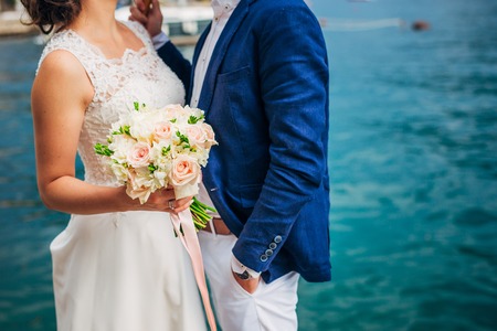 Wedding bouquet in hands of the bride. Wedding in Montenegroの写真素材
