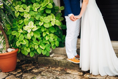 Female and male feet on the pavement. Wedding in Montenegroの写真素材