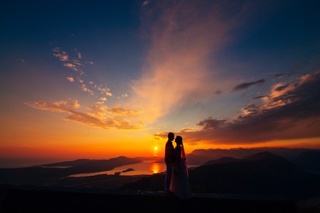 Silhouettes at sunset on Mount Lovcen in Montenegroの写真素材