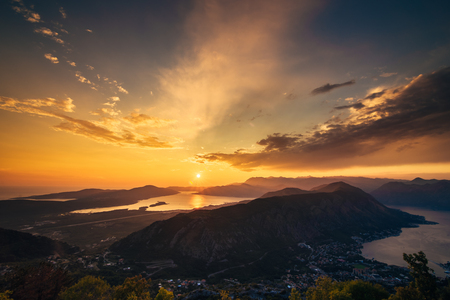 Sunset in Montenegro over the mountains and the sea. Orange sunsets.の写真素材