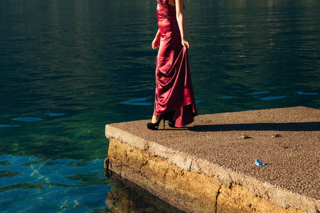 Female and male feet on the dock. Wedding in Montenegroの写真素材