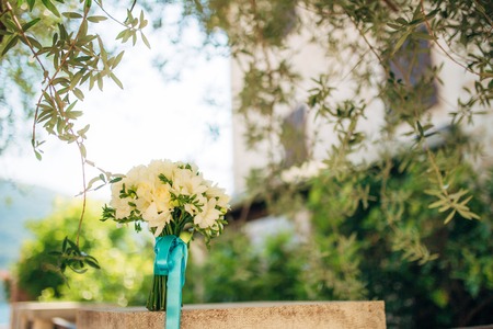 Wedding bouquet on a green background. Wedding in Montenegroの写真素材