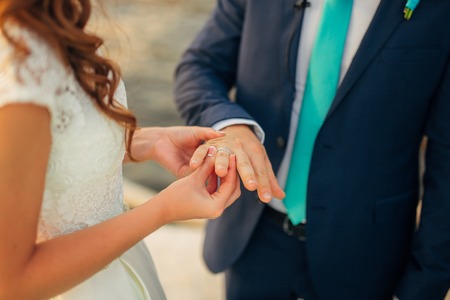 The newlyweds exchange rings at a wedding in Montenegro.の写真素材