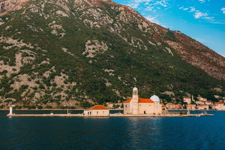 The island of Gospa od Skrpela in the Boko-Kotorsky Gulf near the town of Perast in Montenegro.の写真素材