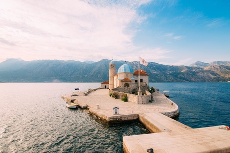 The island of Gospa od Skrpela in the Boko-Kotorsky Gulf near the town of Perast in Montenegro.の写真素材