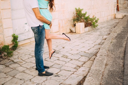 Female and male feet on the pavement. Wedding in Montenegroの写真素材