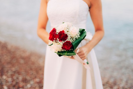 Wedding bouquet in hands of the bride. Wedding in Montenegroの写真素材