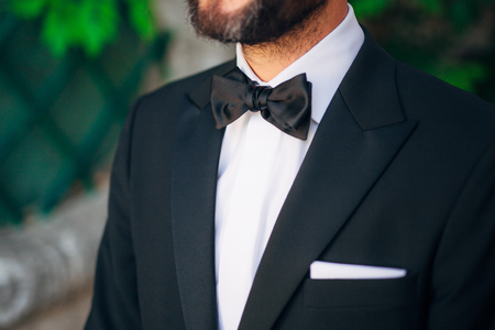 Tie Butterfly close-up. Wedding groom suit. Wedding in Montenegroの写真素材