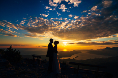 Silhouettes at sunset on Mount Lovcen in Montenegroの写真素材