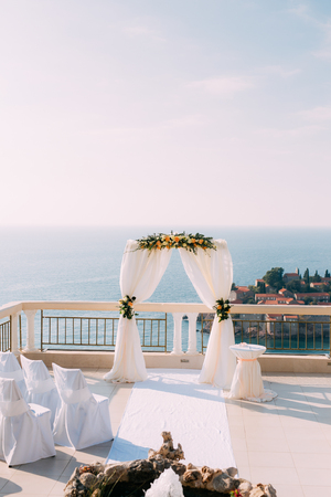 Arch for the wedding ceremony on the seaの写真素材