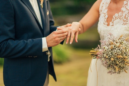 The newlyweds exchange rings at a wedding in Montenegro.
