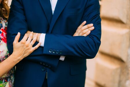 Bride and groom at wedding Day walking Outdoors on spring nature. Bridal couple, Happy Newlywed woman and man embracing in green park. Loving wedding couple outdoor. Bride and groomの写真素材