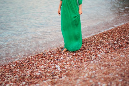 Female feet on the beach in Montenegro.の写真素材