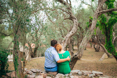 The couple hugs in an olive grove. Wedding in Montenegro.の写真素材