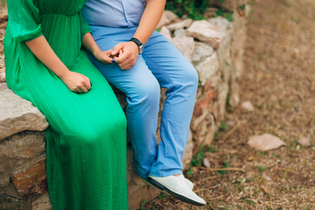Female and male feet on the rocks. Wedding in Montenegroの写真素材