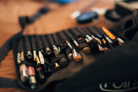 Case makeup artist. A set of brushes, powder, foundation. Tools make-up artist in a boxの写真素材