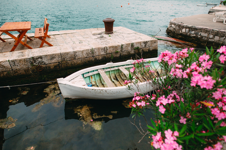 The old town of Perast on the shore of Kotor Bay, Montenegro. The ancient architecture of the Adriatic and the Balkans. Boats and yachts on the dock.の写真素材