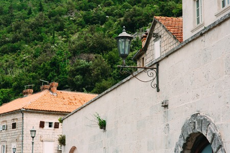 Vintage lamp on the wall on the street.の写真素材