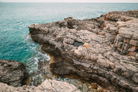 Rocks on the sea in Montenegro. Rocky coast. Wild beach. Dangerous coast.の写真素材