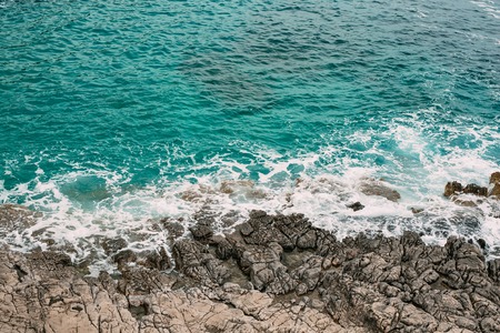Rocks on the sea in Montenegro. Rocky coast. Wild beach. Dangerous coast.の写真素材