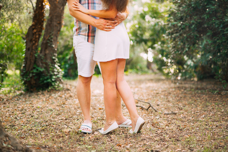 The groom embraces the bride in the forest. Wedding in Montenegro and Croatia.の写真素材