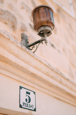 Vintage lamp on the wall on the street.の写真素材