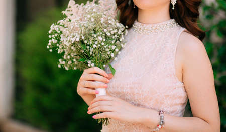 Wedding bridal bouquet of Gypsophila in the hands of the bride. Wedding in Montenegro.の写真素材