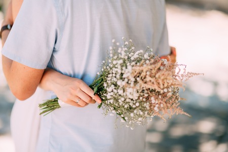 The bride is hugging the groom. Wedding in Montenegro.の写真素材