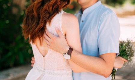 The groom embraces the bride in the forest. Wedding in Montenegro and Croatia.の写真素材