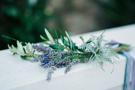 Wedding bouquet of lavender with ribbon on a stone backgroundの写真素材