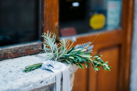 Wedding bouquet of lavender with ribbon on a stone backgroundの写真素材