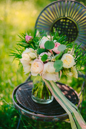 Wedding bouquet of peonies on a vintage metal chair Wedding in Montenegro.の写真素材