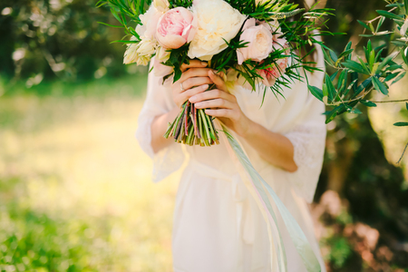 Wedding bouquet of peonies in the hands of the bride. Wedding in Montenegro.の写真素材