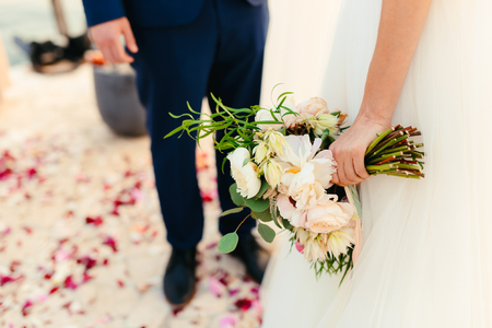 Wedding bouquet of peonies in the hands of the bride. Wedding in Montenegro.の写真素材