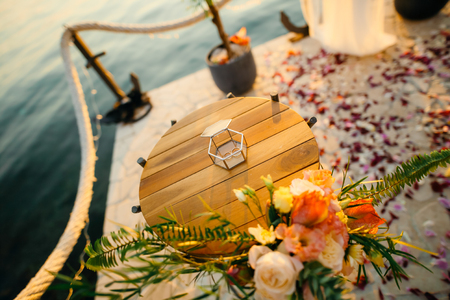 Wedding rings in a glass box for rings. Wedding jewelry.の写真素材