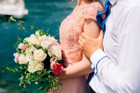 Wedding roses and peonies in the hands of the bride. Wedding in Montenegro.の写真素材
