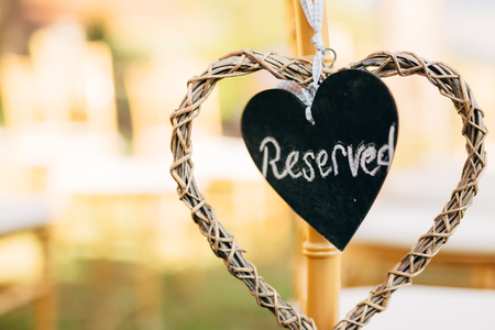 Plate Reserved on the chair at the wedding. Chairs at the wedding ceremony. Wedding in Montenegro.の写真素材