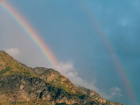 Double rainbow over the mountains. Montenegrin Mountains, the Balkans.の写真素材