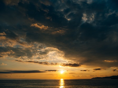 Sunset over the sea. Sunset over the Adriatic Sea. Sun to sit down in the waterの写真素材