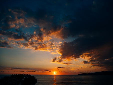 Sunset over the sea. Sunset over the Adriatic Sea. Sun to sit down in the waterの写真素材