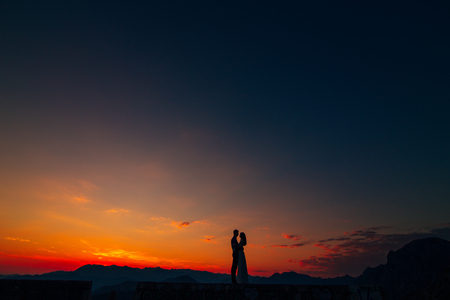 Silhouettes at sunset on Mount Lovcen in Montenegroの写真素材