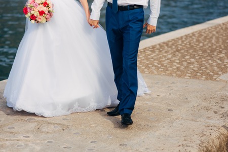 Bride and groom holding hands. Wedding in Montenegroの写真素材