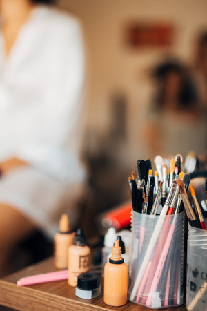 Case makeup artist. A set of brushes, powder, foundation. Tools make-up artist in a boxの写真素材