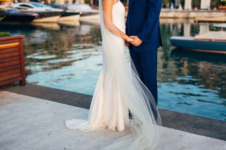 Bride and groom holding hands. Wedding in Montenegroの写真素材
