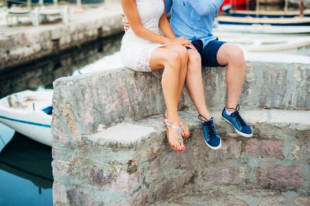 Female and male feet on the dock. Wedding in Montenegroの写真素材