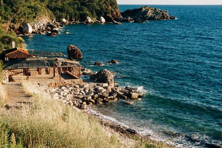 Cafe on a rocky sea shore in Montenegro. Deserted beachの写真素材