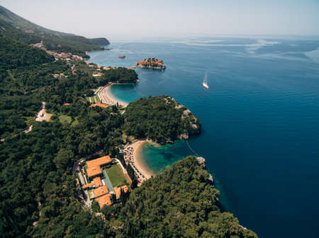 Budva, Montenegro - 10 june 2019: Hotel spa Aman Resorts Sveti Stefan. A luxury hotel on the Adriatic coast in Montenegro. Beach and coastline. Aerial photo. The concept of a rich luxury lifeのeditorial素材